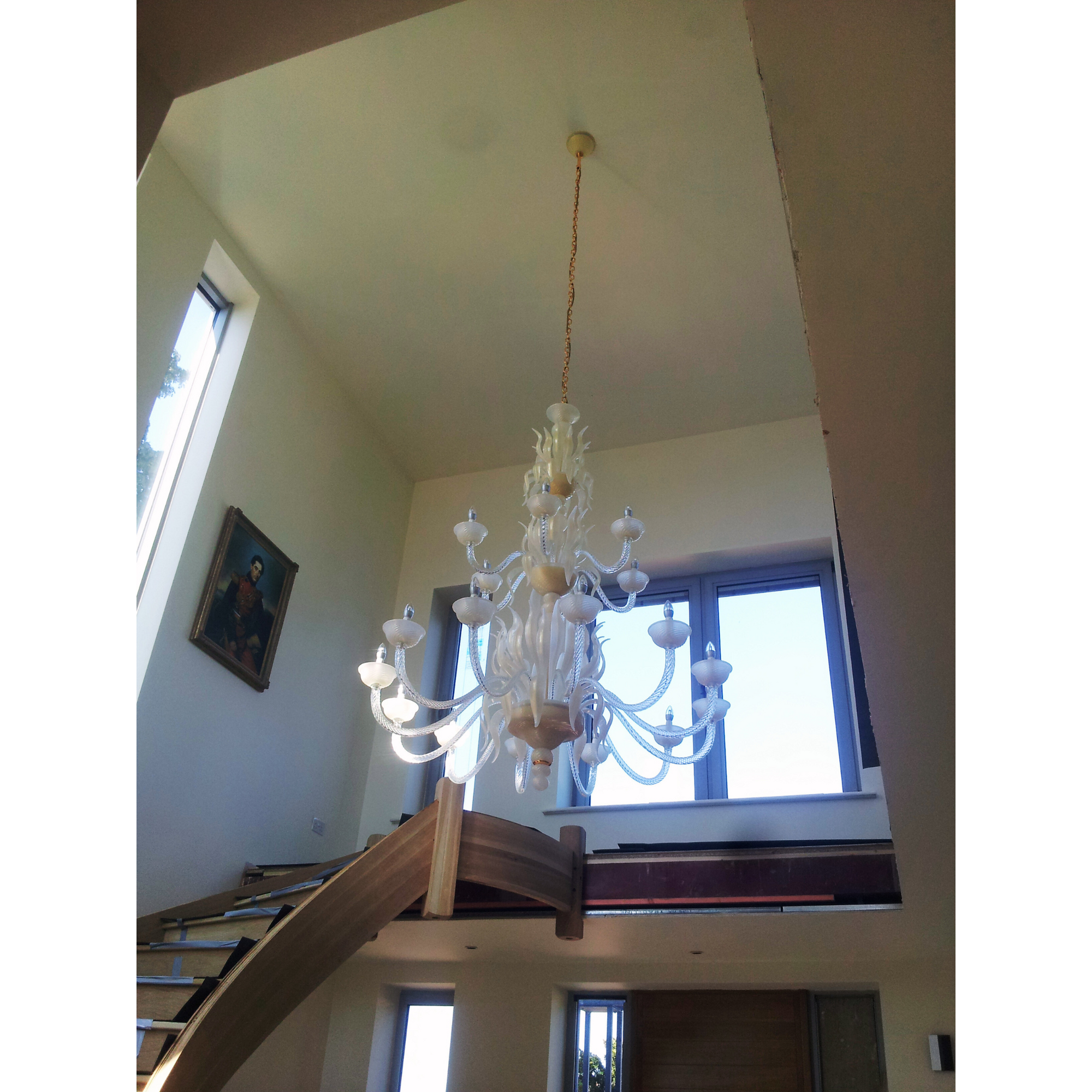 Classic Three-Tier Murano Glass Chandelier in a contemporary home, showing its full elegant design.