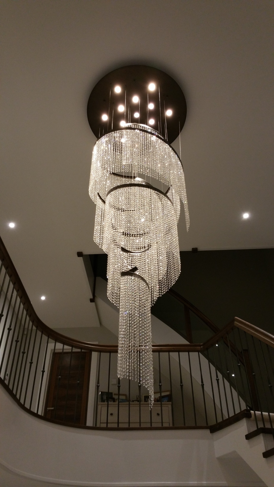 Detailed perspective of the Asymmetric Crystal Spiral chandelier's cascading design