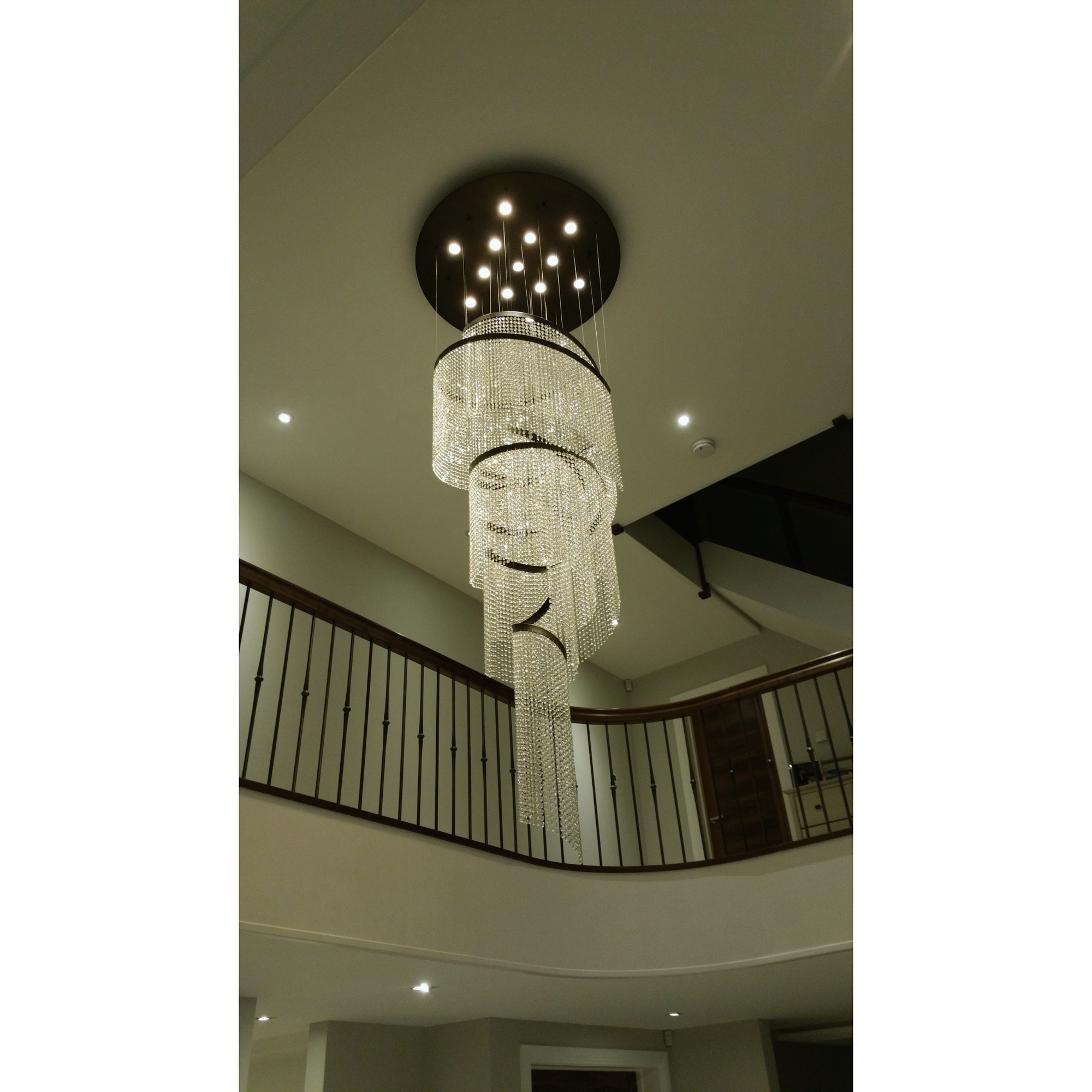 Asymmetric Crystal Spiral chandelier with a focus on the layered crystal strands for a sophisticated look