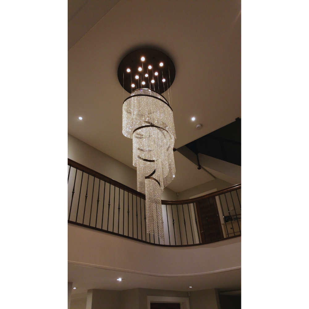 Luxurious crystal spiral chandelier in a hallway setting, showcasing intricate detailing