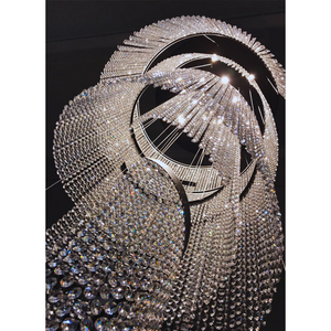 Dynamic view of a cascading crystal chandelier with reflective crystal strands, adding depth to the space