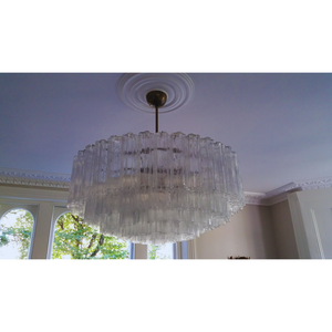 Wide shot of the chandelier in a spacious, well-lit room, blending Italian elegance with a modern setting.