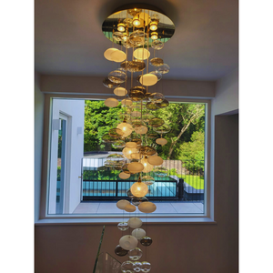 Bubble chandelier viewed from below, showcasing modern design and intricate glass orbs.