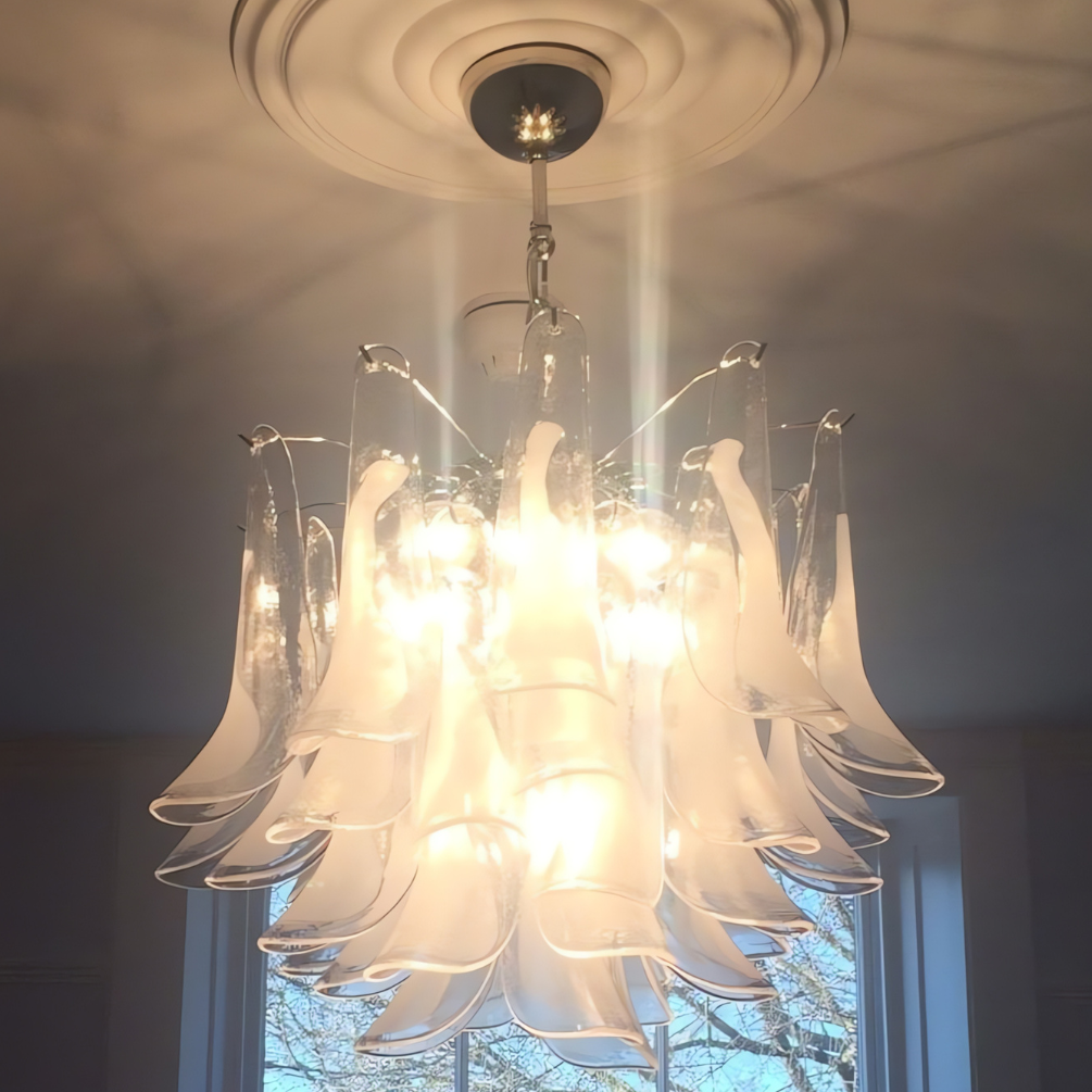 White Petali Murano chandelier fully lit, highlighting the intricate design and ambient light reflections on the ceiling, perfect for a modern or classic interior.