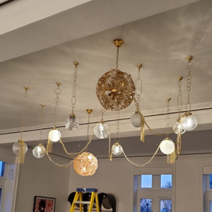 luxury globe ceiling light installation - custom chandelier design