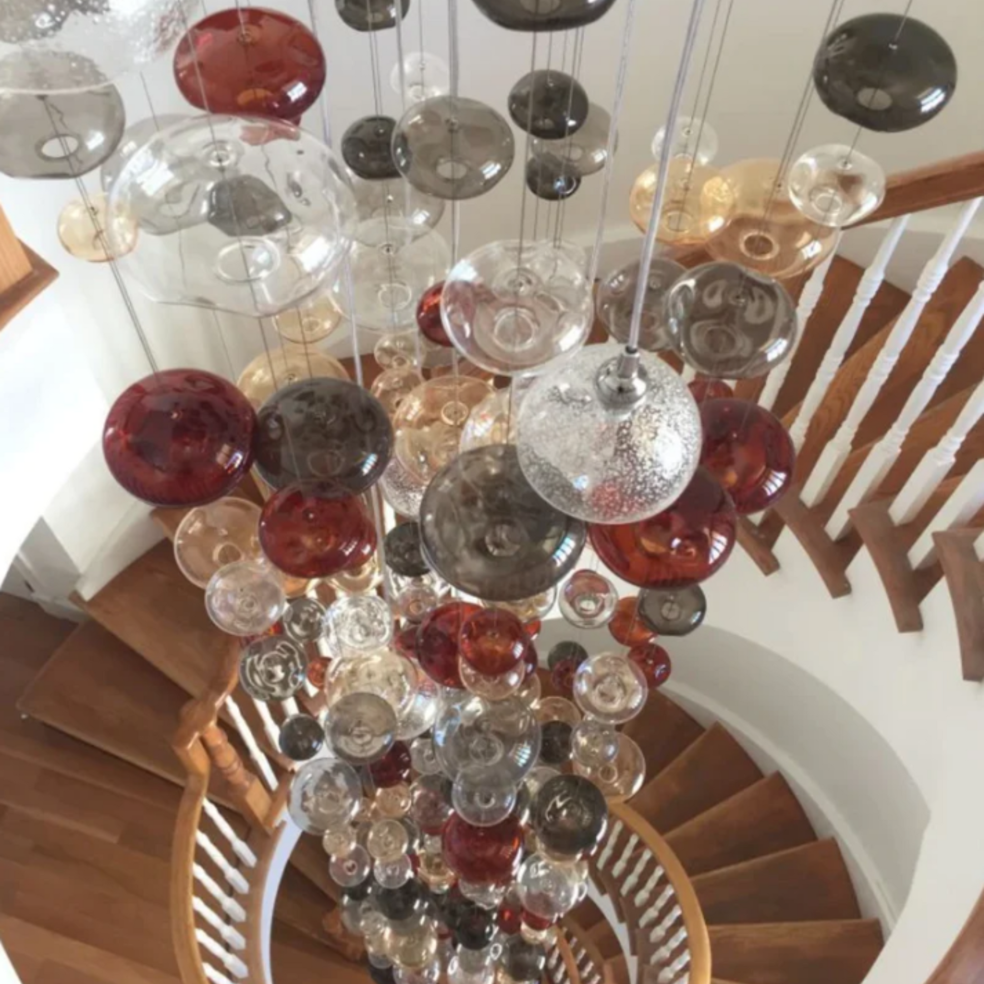 20 Ft Tall Bespoke Stairwell Chandelier With Coloured Glass Bubbles