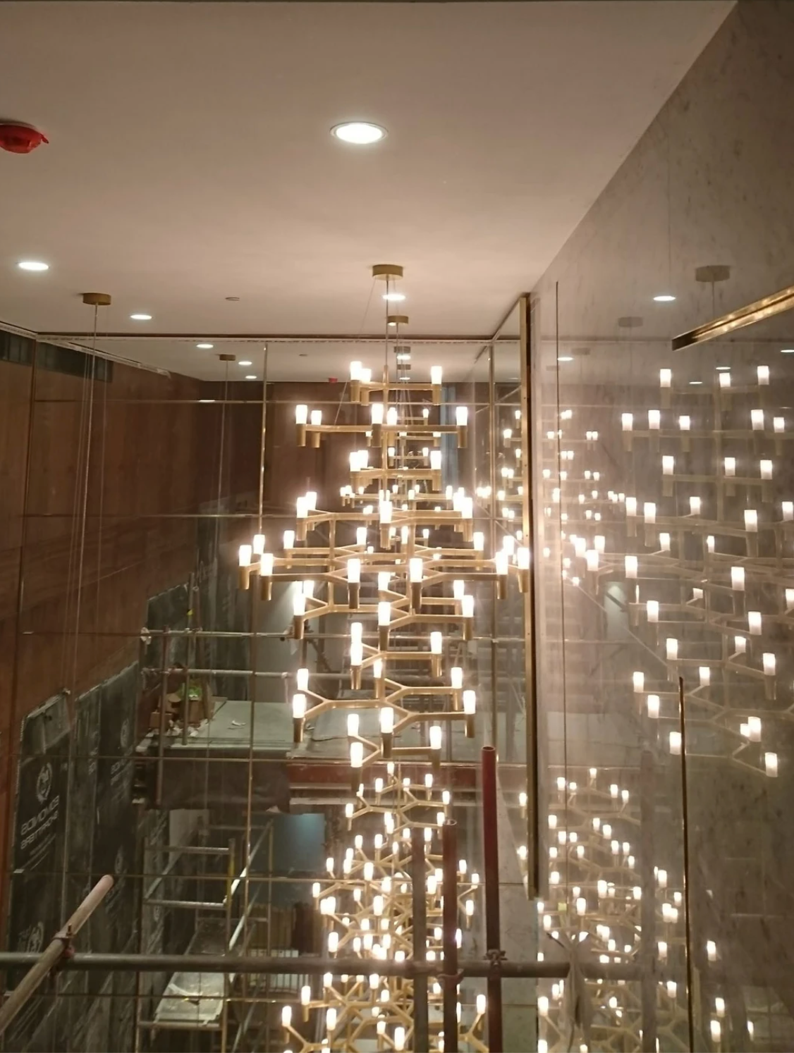 Large bespoke modern ceiling lighting installation for a top London hotel
